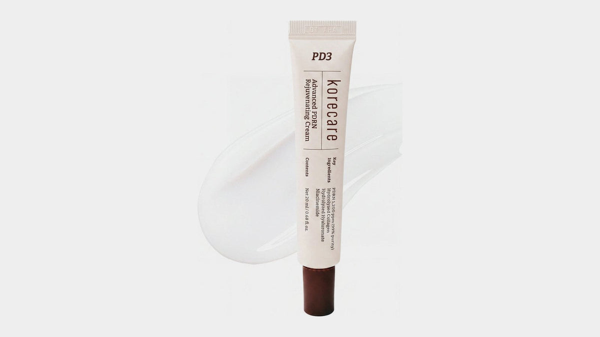 KoreCare PDRN cream tube with a swatch of white gel cream on a light grey background